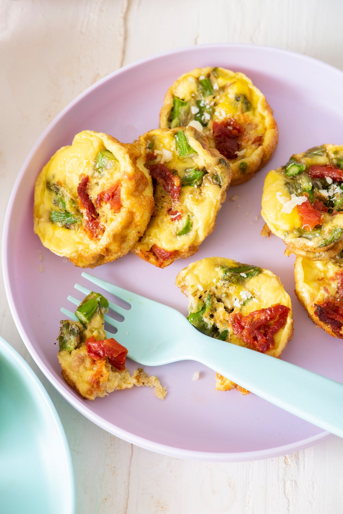 Close up of baby frittatas with fork. 