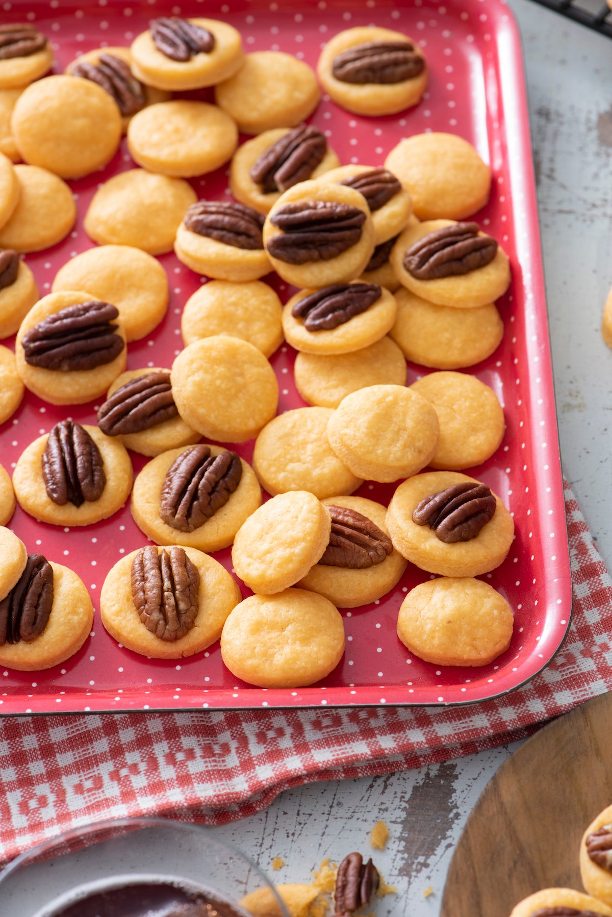 Cheese Wafers topped with pecans.