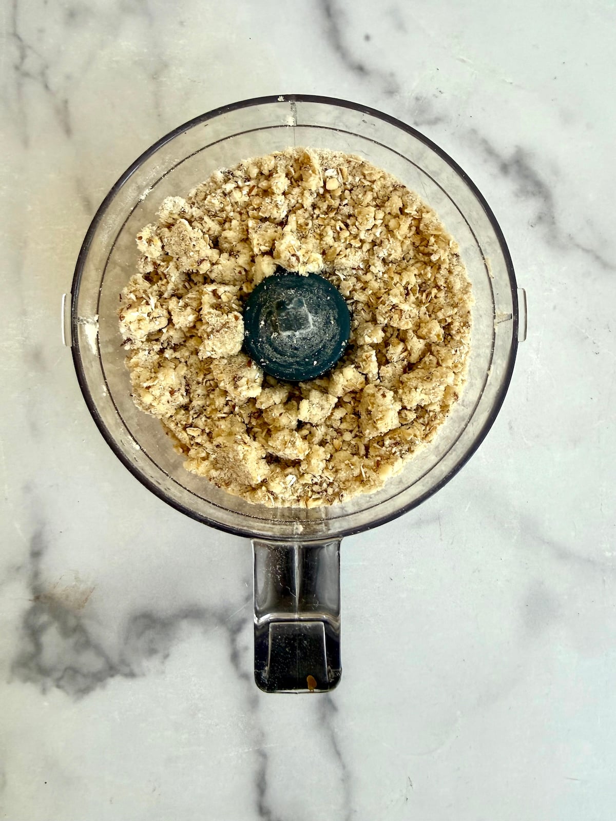 Oat crumble topping pulsed to a sandy, clumpy texture in a food processor.