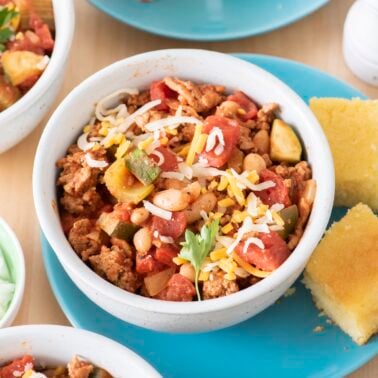 Turkey veggie chili in a bowl served with cornbread.