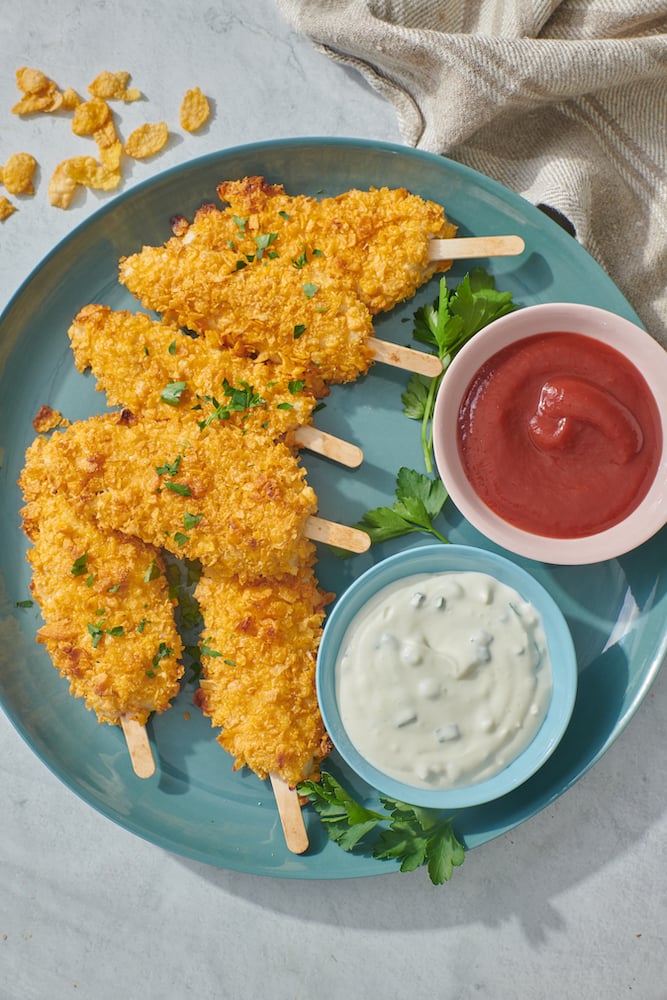 serving platter with chicken fingers on a stick