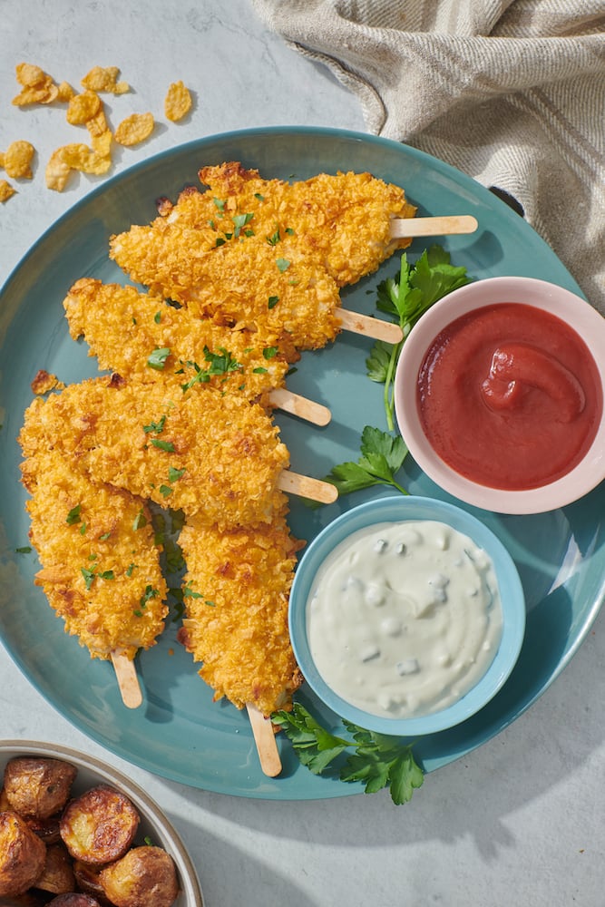 Platter with chicken on a stick, ketchup and ranch