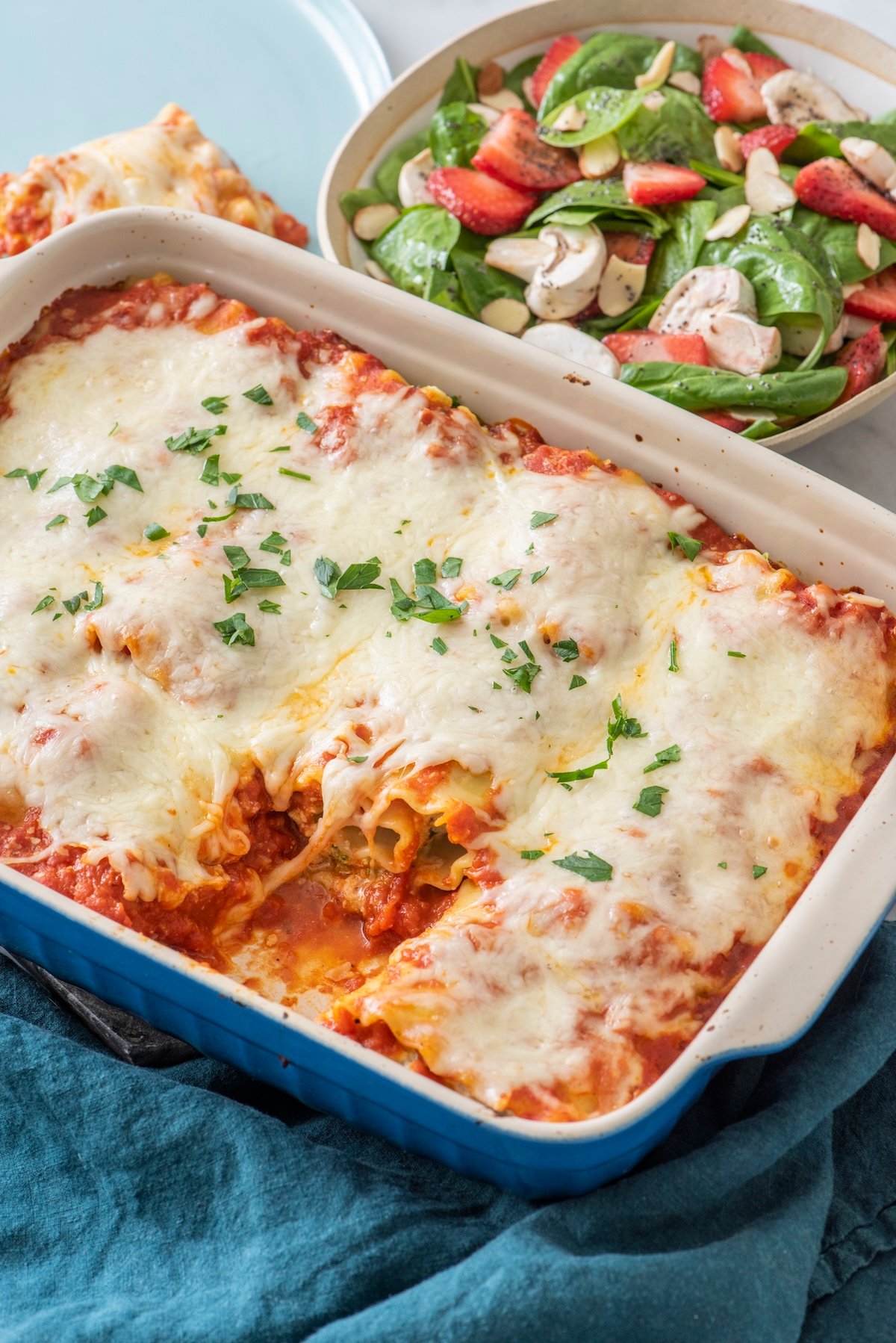 Lasagna rolls in a baking dish.