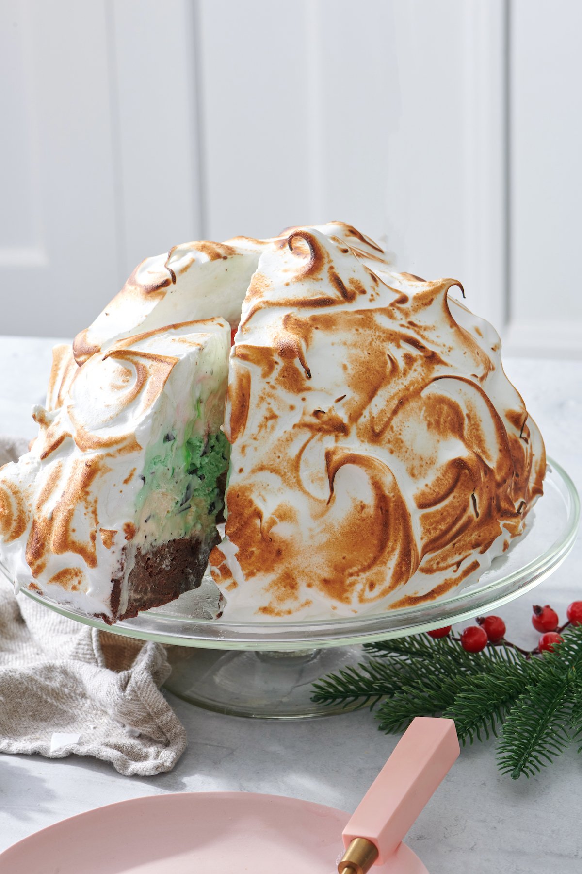Removing a slice from Holiday Baked Alaska.