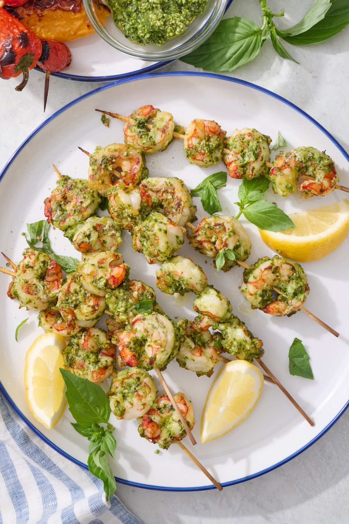 Pesto Shrimp Skewers on large white plate.