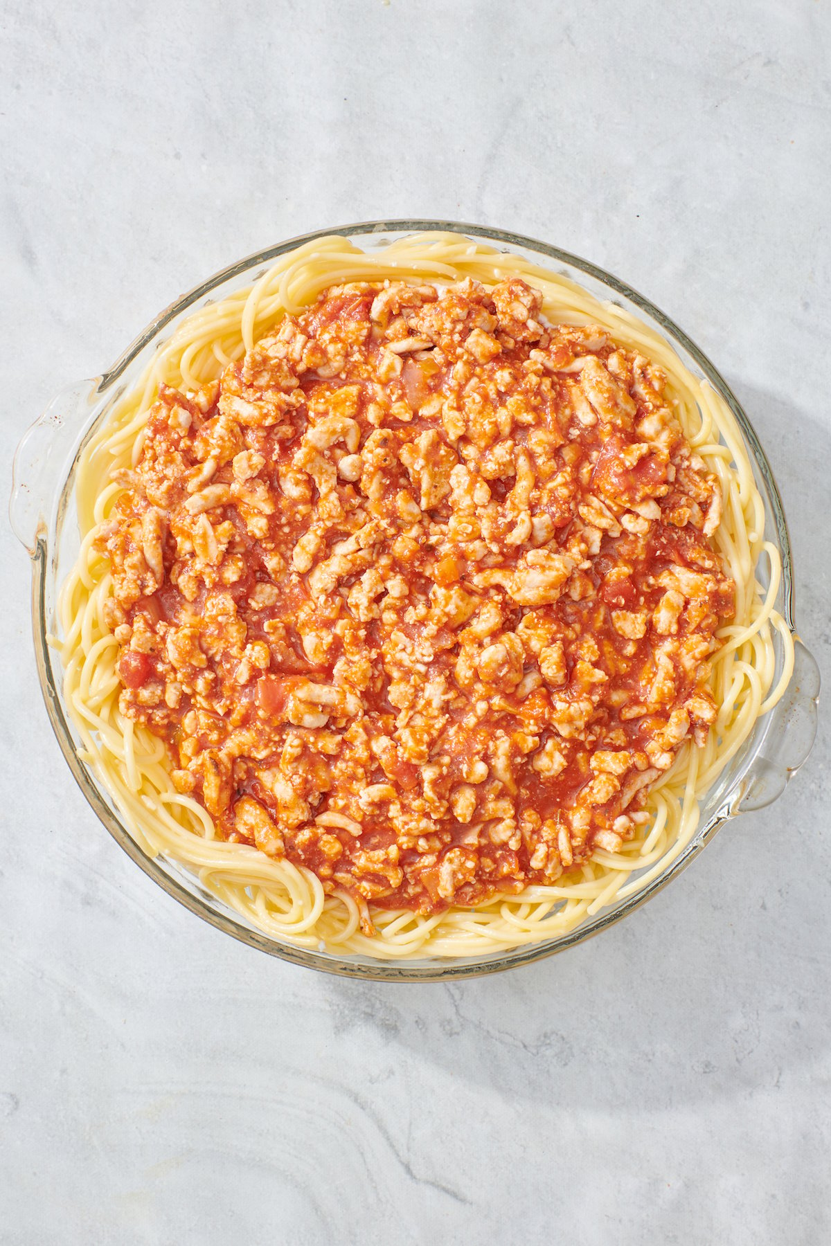 Meat sauce layered in spaghetti pie.