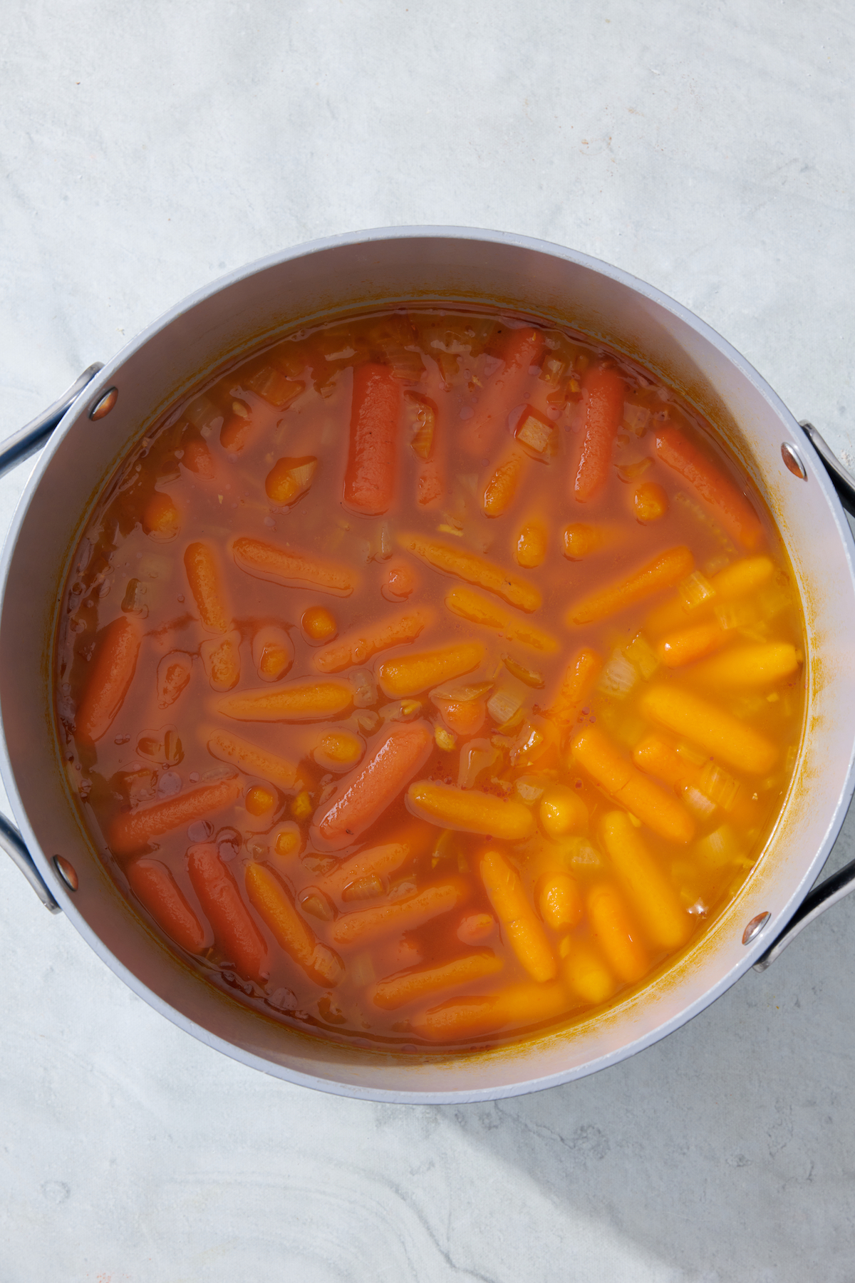 cooked carrots in vegetable broth