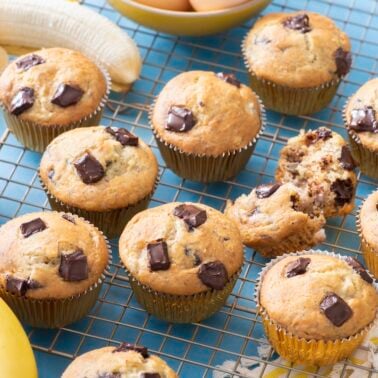 Banana chocolate chip muffins cooling on wire rack.