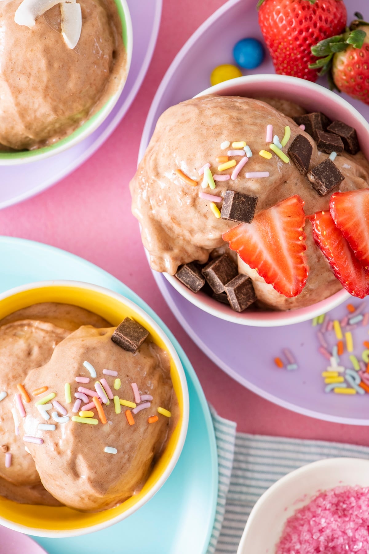 Chocolate banana ice cream topped with strawberries.