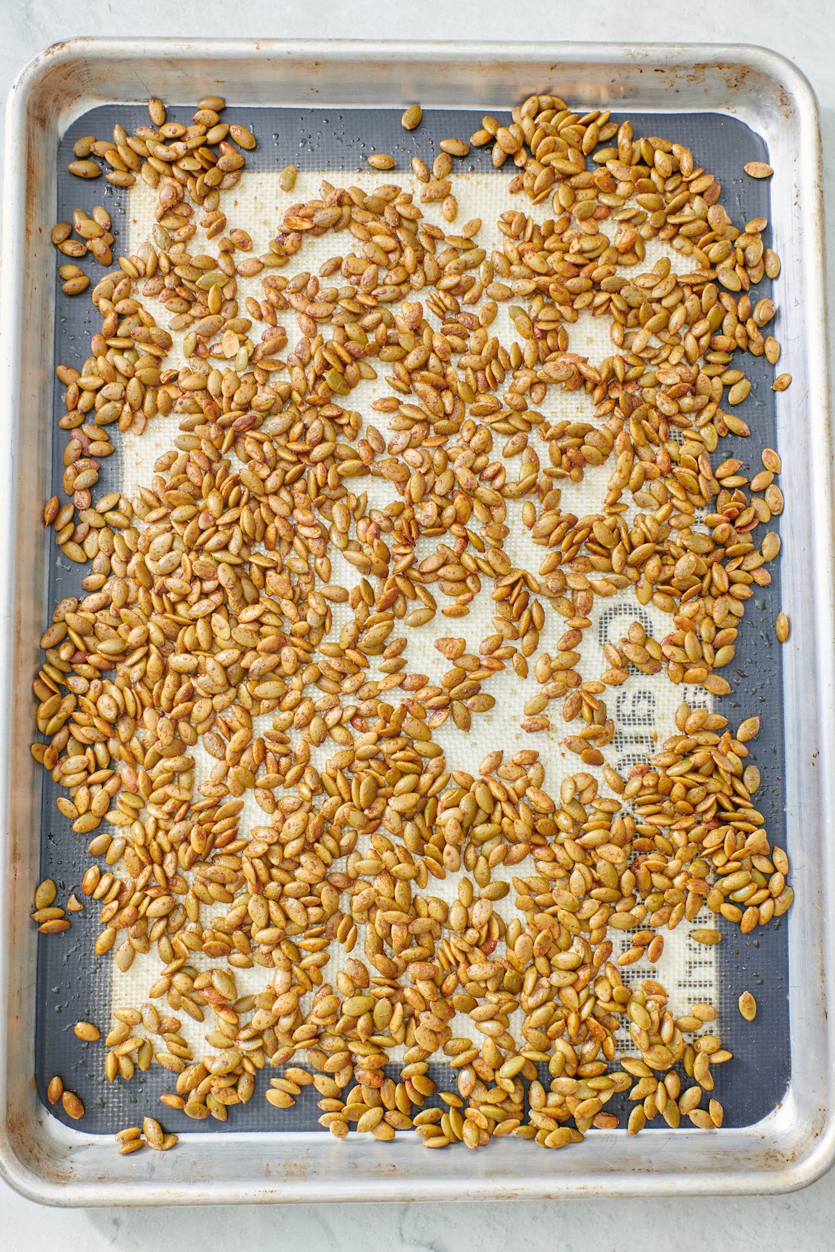 Pumpkin Seeds on baking sheet after roasting.