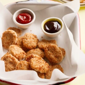 easy chicken nuggets served with ketchup and barbecue sauce.