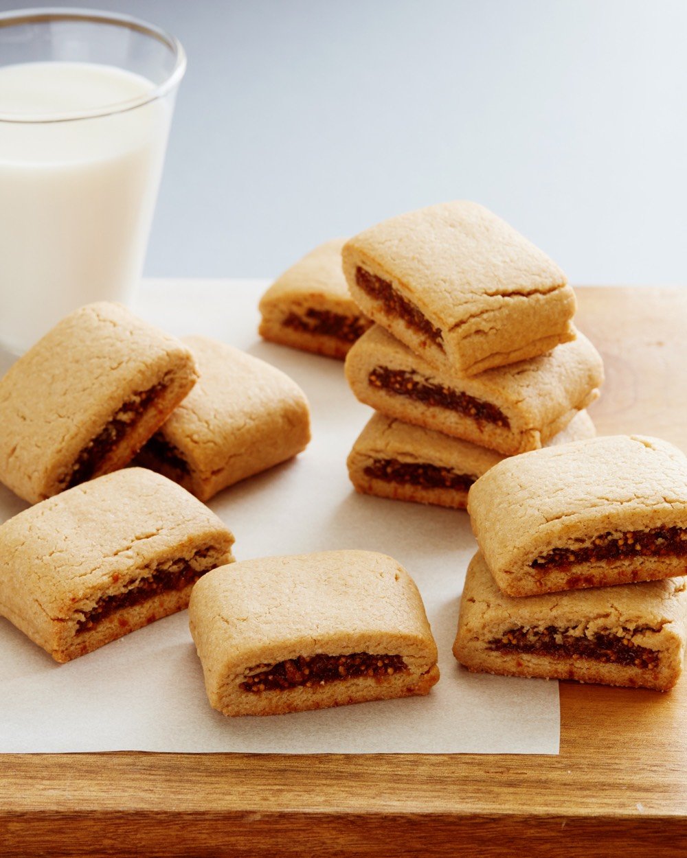 Homemade Fig Bars served with a glass of milk.