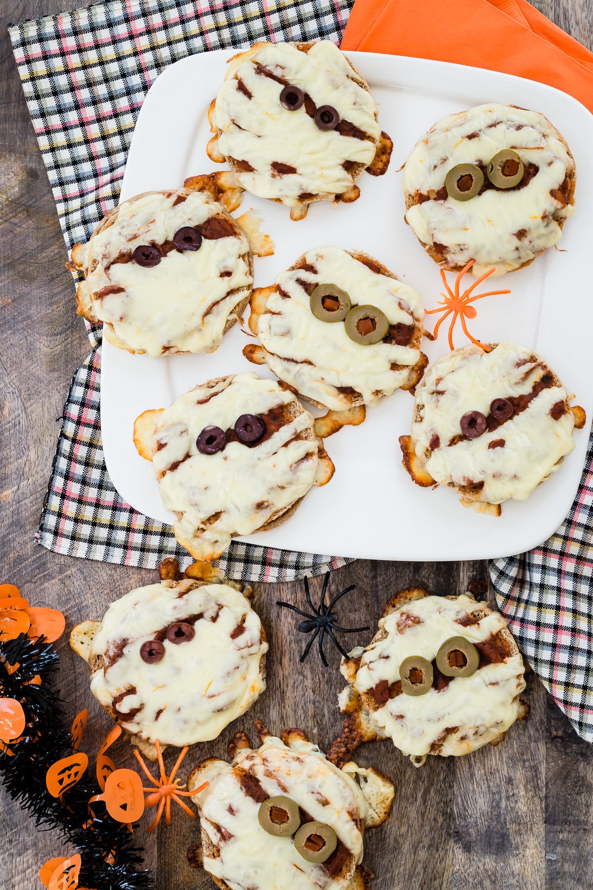 Halloween pizza mummies on a serving platter.