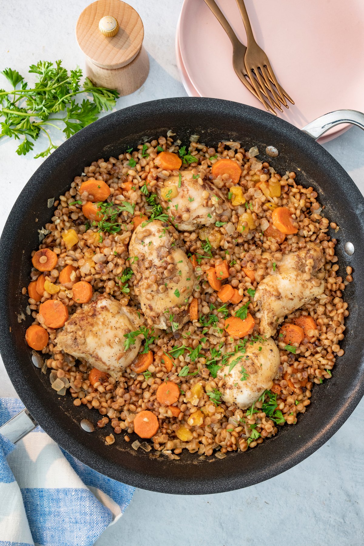 One Pot Spiced Chicken with Toasted Couscous in saute pan.