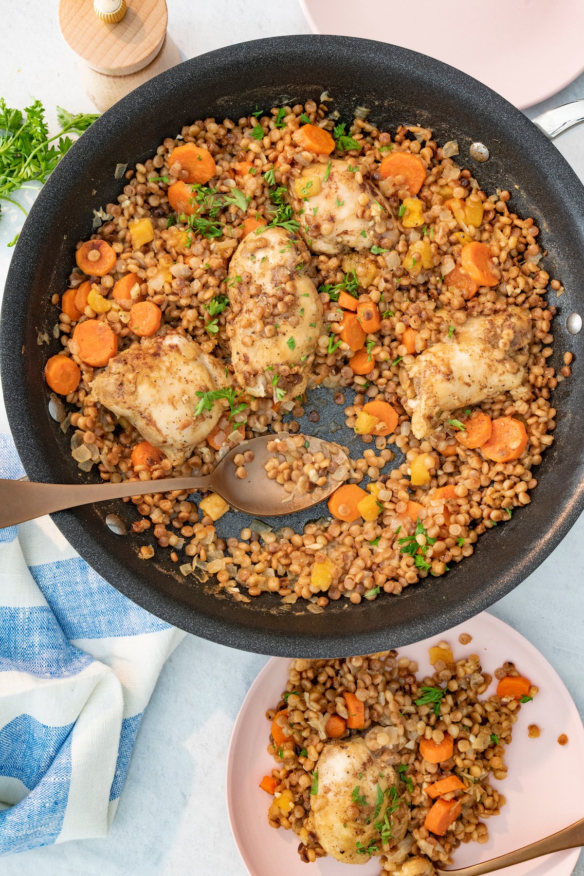 One Pot Spiced Chicken with toasted couscous in saute pan. 
