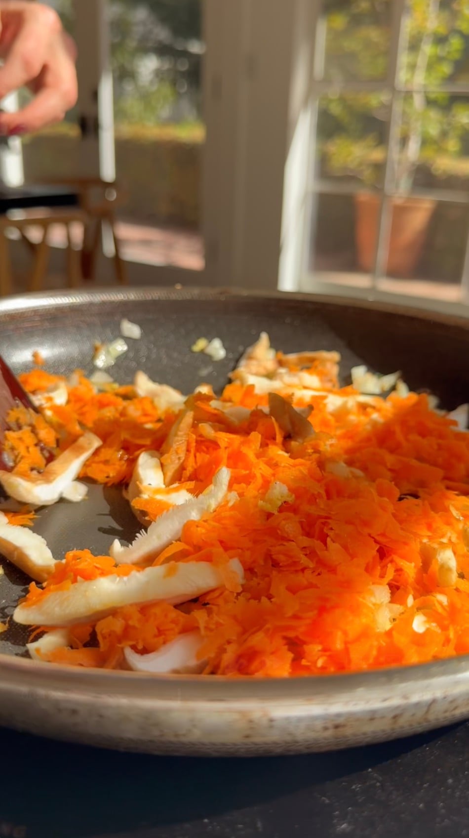 Sauteed vegetables in a pan.