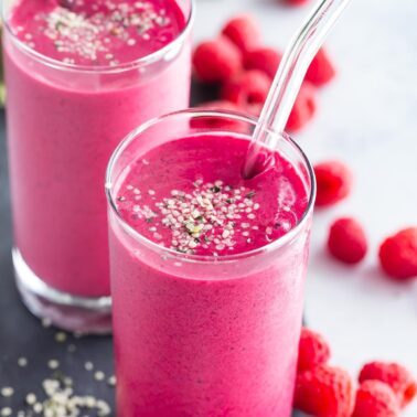 Two glasses of dragon fruit raspberry smoothie.
