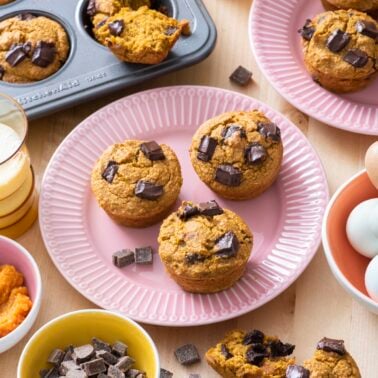 Flourless pumpkin chocolate muffins on serving plate.