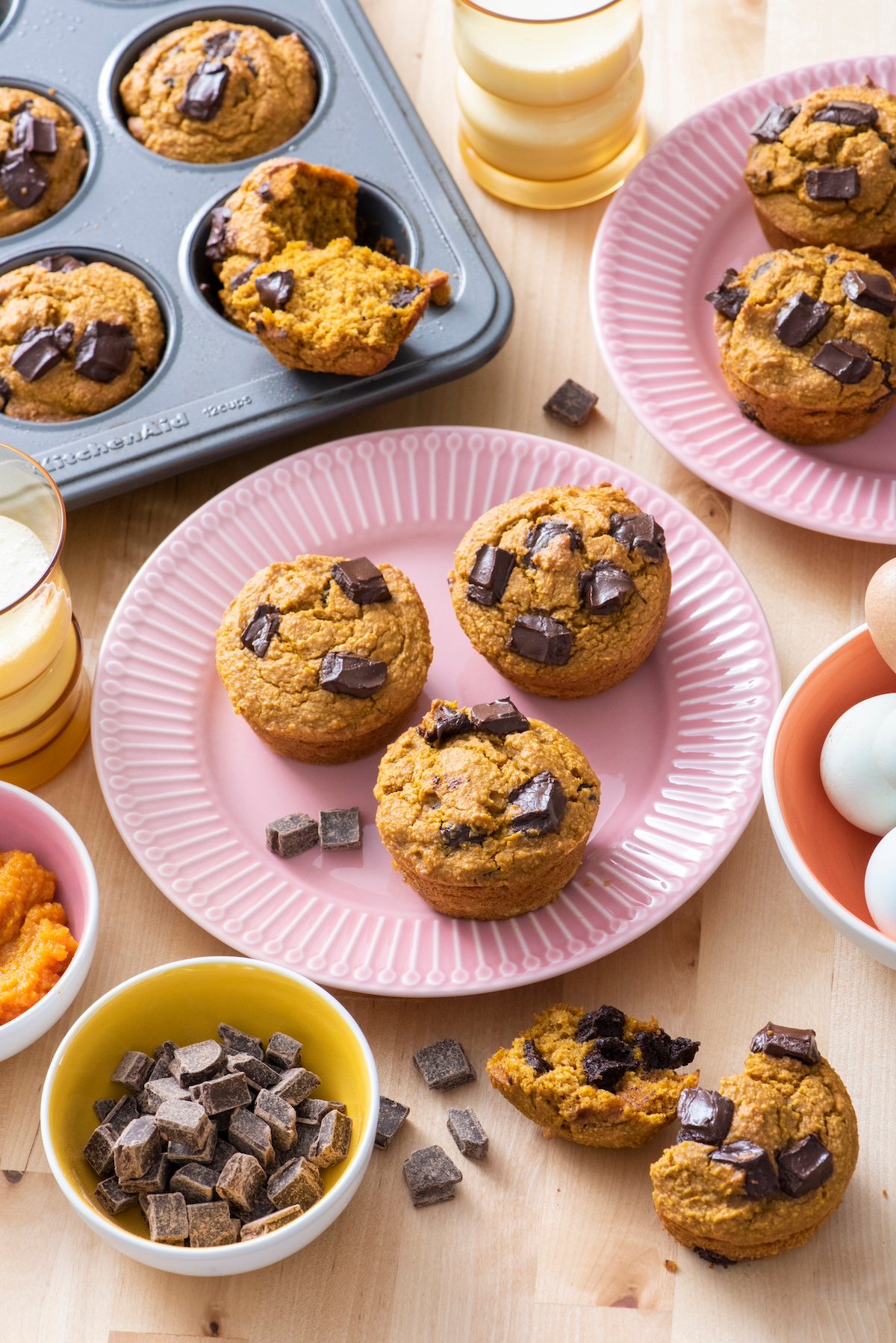 Flourless pumpkin chocolate muffins on serving plate.