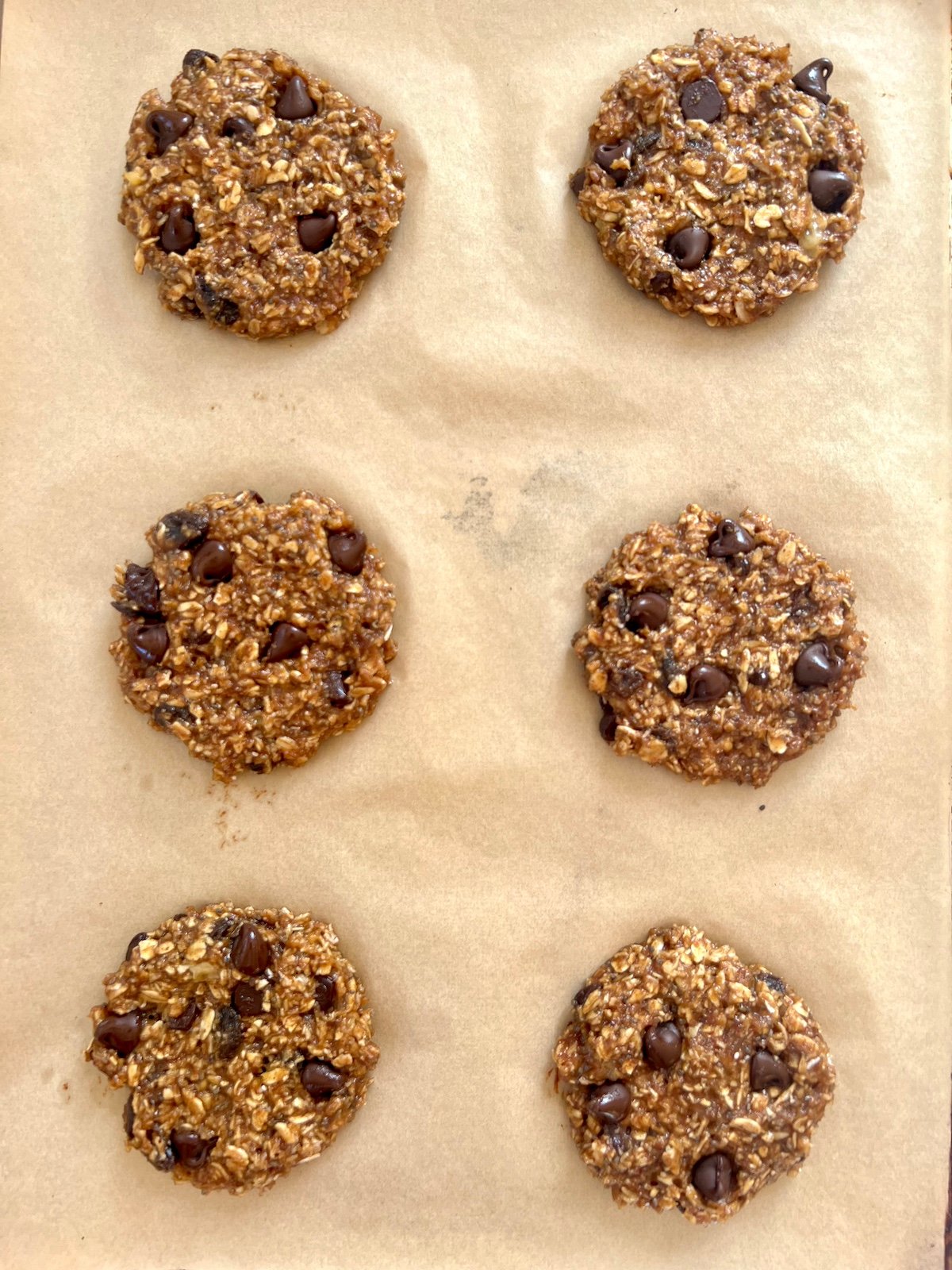 Baked protein cookies on baking sheet.