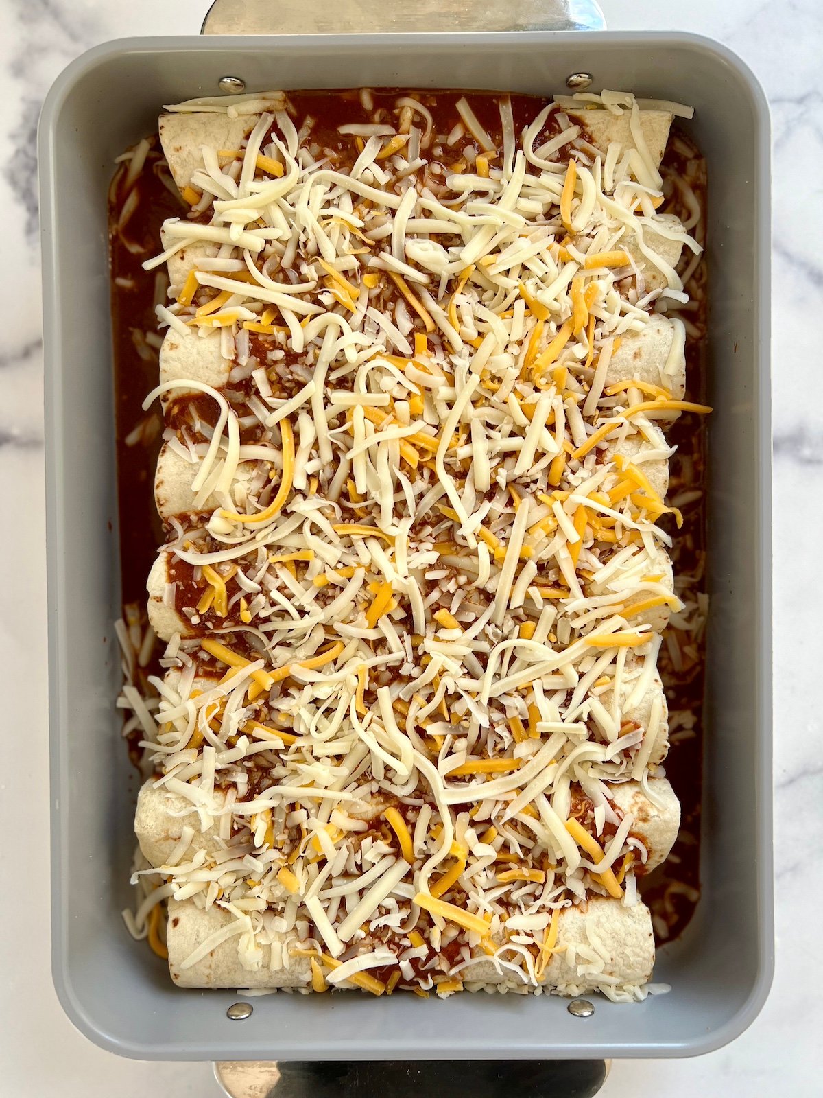 Enchiladas assembled, ready to bake.