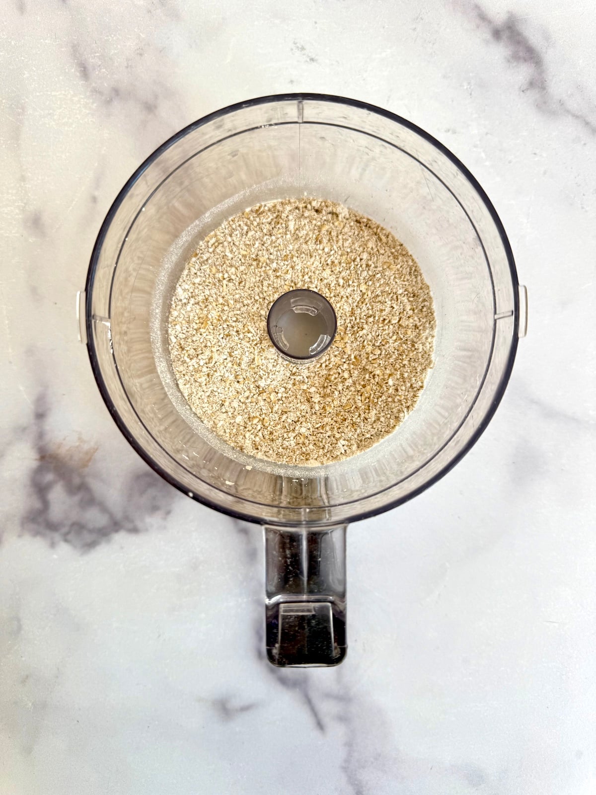 Rolled oats ground into a fine powder in a food processor.
