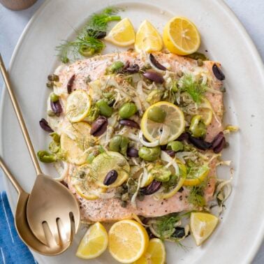 Baked salmon on serving platter.