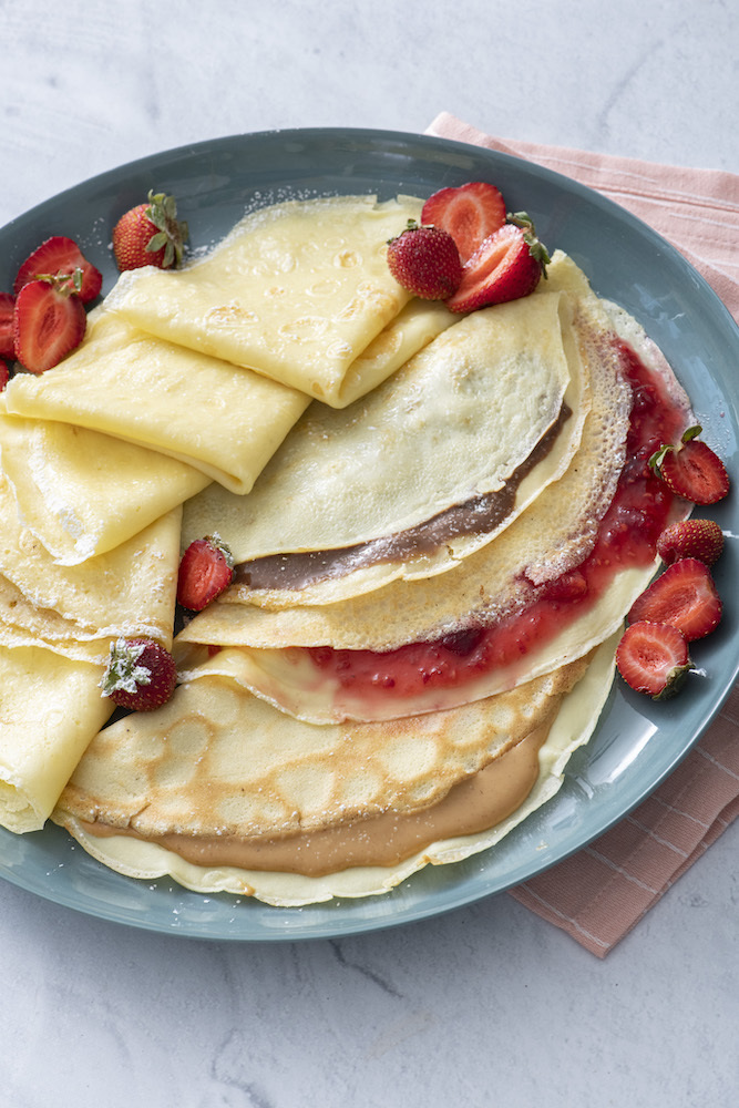 Three crepes filled with nutella, strawberry jam and peanut butter