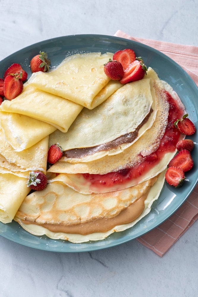 Three crepes filled with nutella, strawberry jam and peanut butter