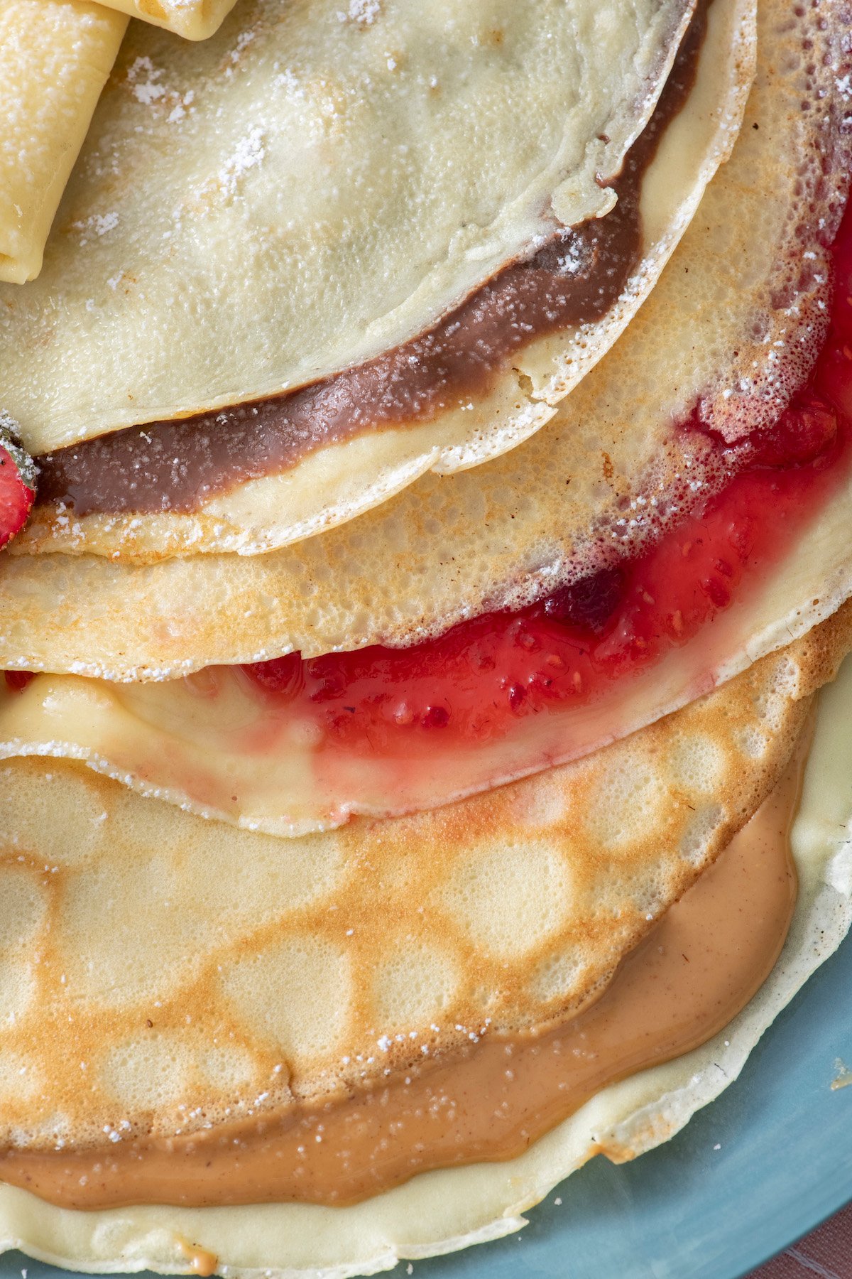 Crepes. One filled with Nutella, one with fruit preserves and one with peanut butter. 