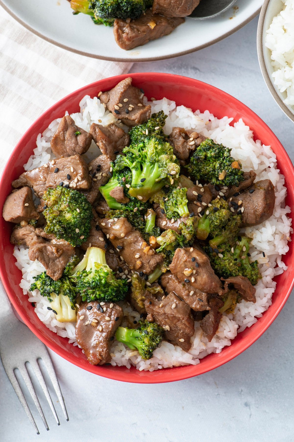 Beef and broccoli served over white rice.