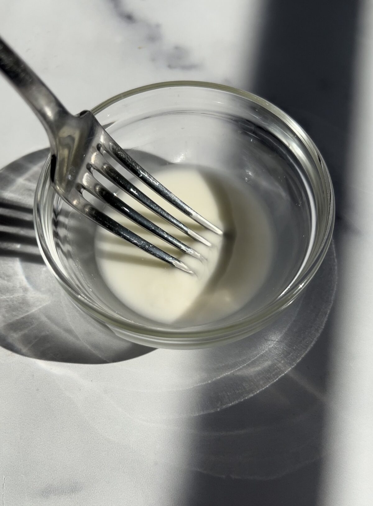 Corn starch slurry in small glass bowl.