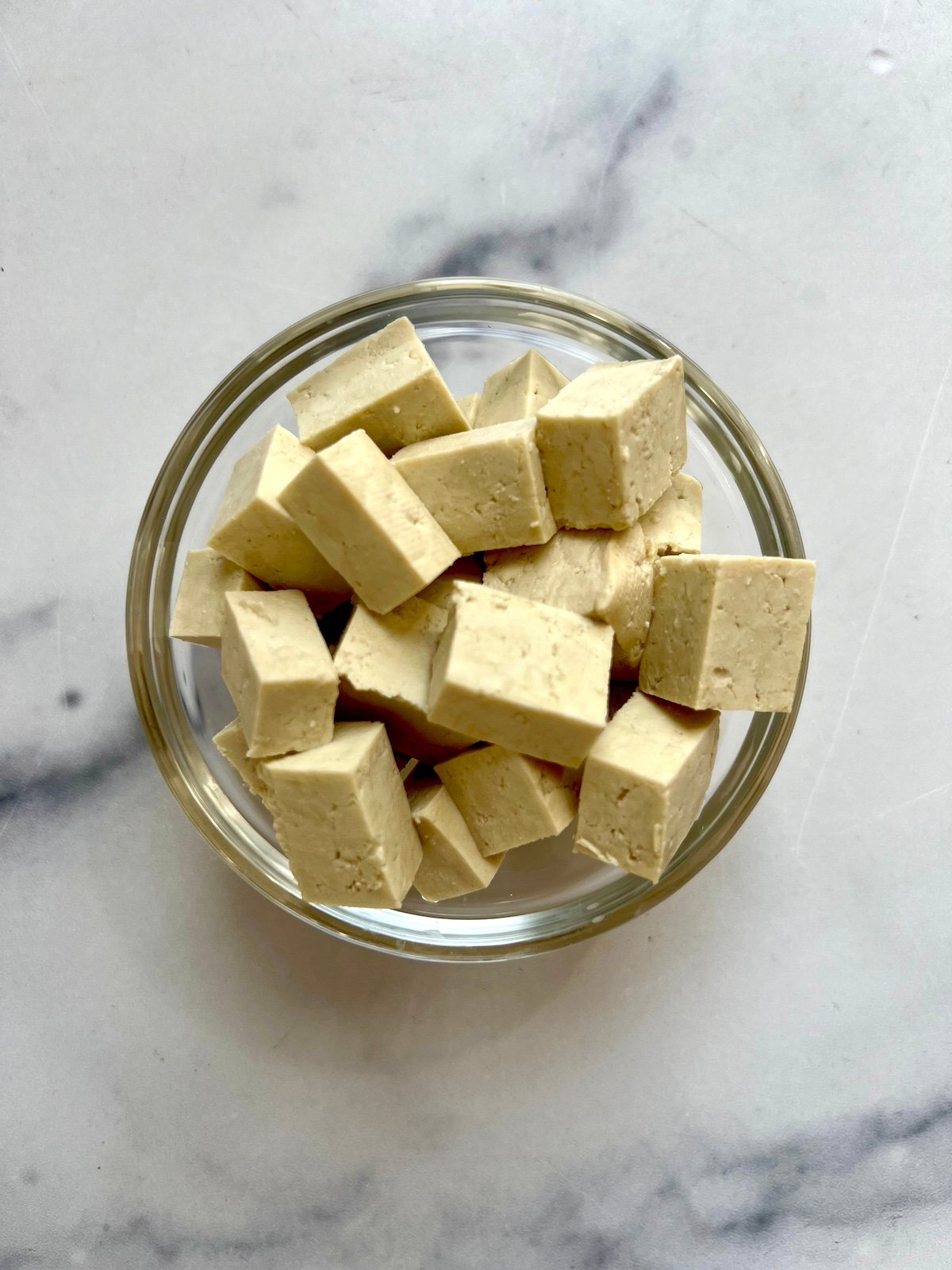 Cubed tofu in small bowl.