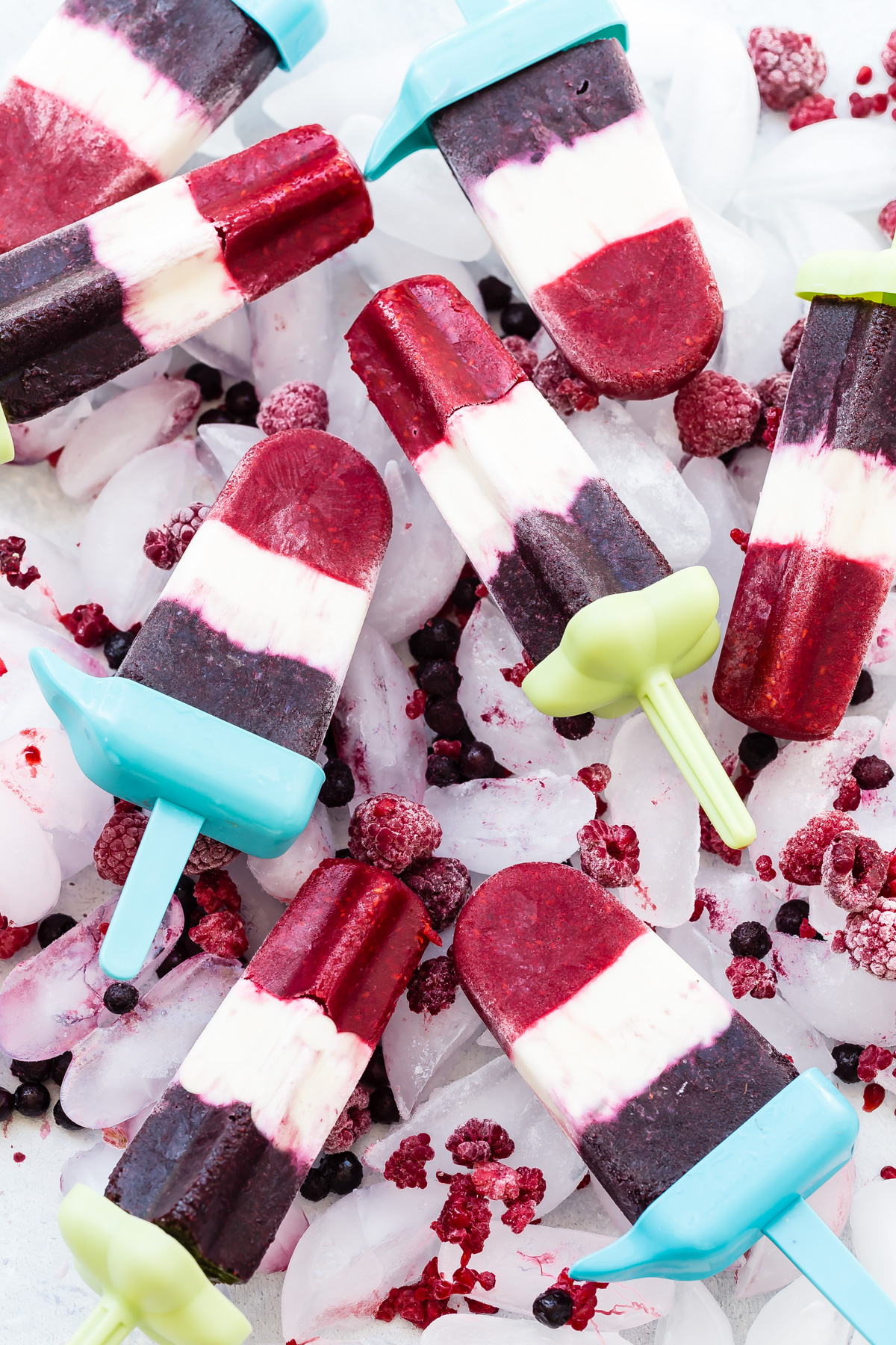 Red, white and blue popsicles on a bed of ice.