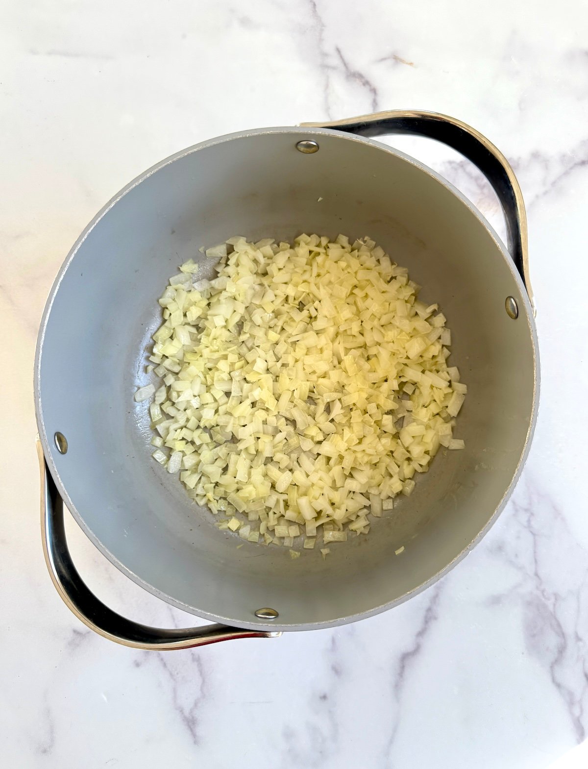 Sauteed onions in a large pot.