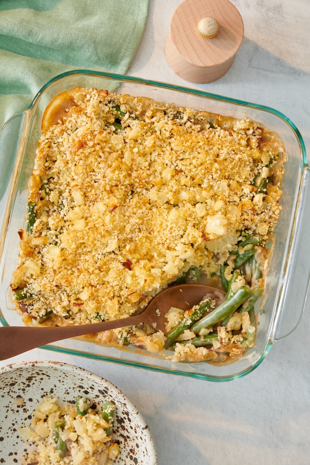 Green bean casserole in a glass baking dish.