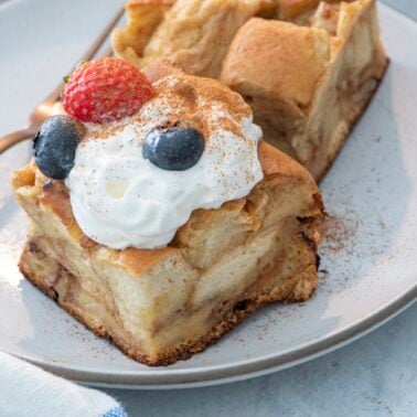 Challah bread pudding slice on a plate.