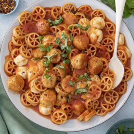 Pasta with tomato sauce and meatballs.
