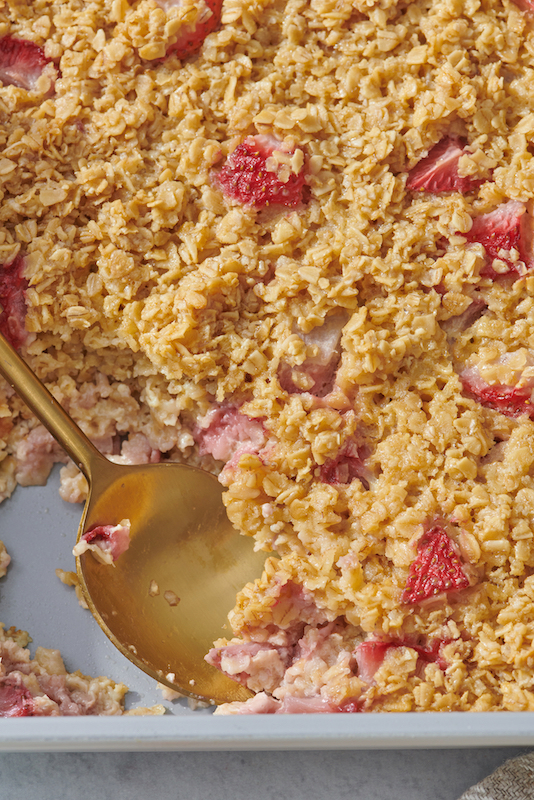 close up shot of oatmeal and strawberries