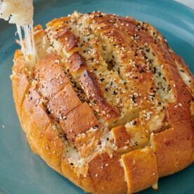 Pull apart cheese bread on a serving plate.