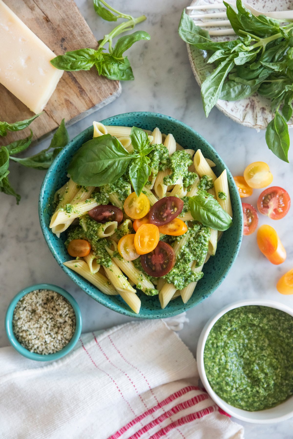 hemp seed pesto over penne pasta and topped with halved cherry tomatoes