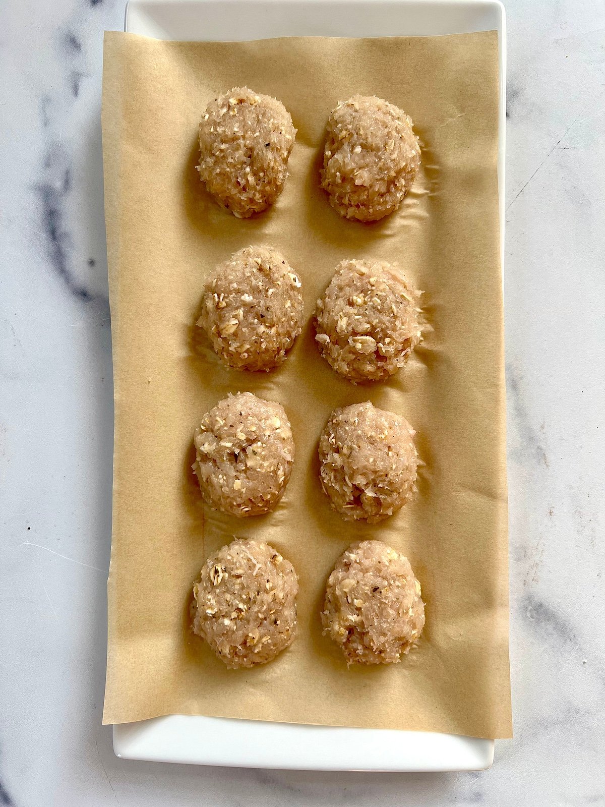 Chicken nuggets on parchment paper.