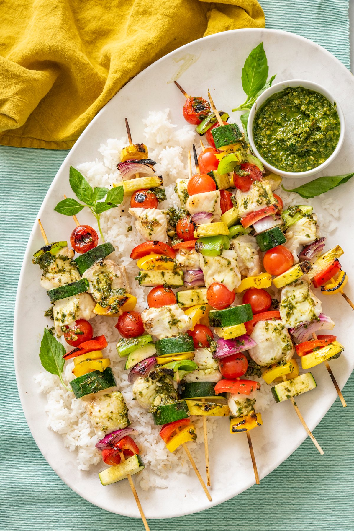 halibut on skewers with vegetables and pesto