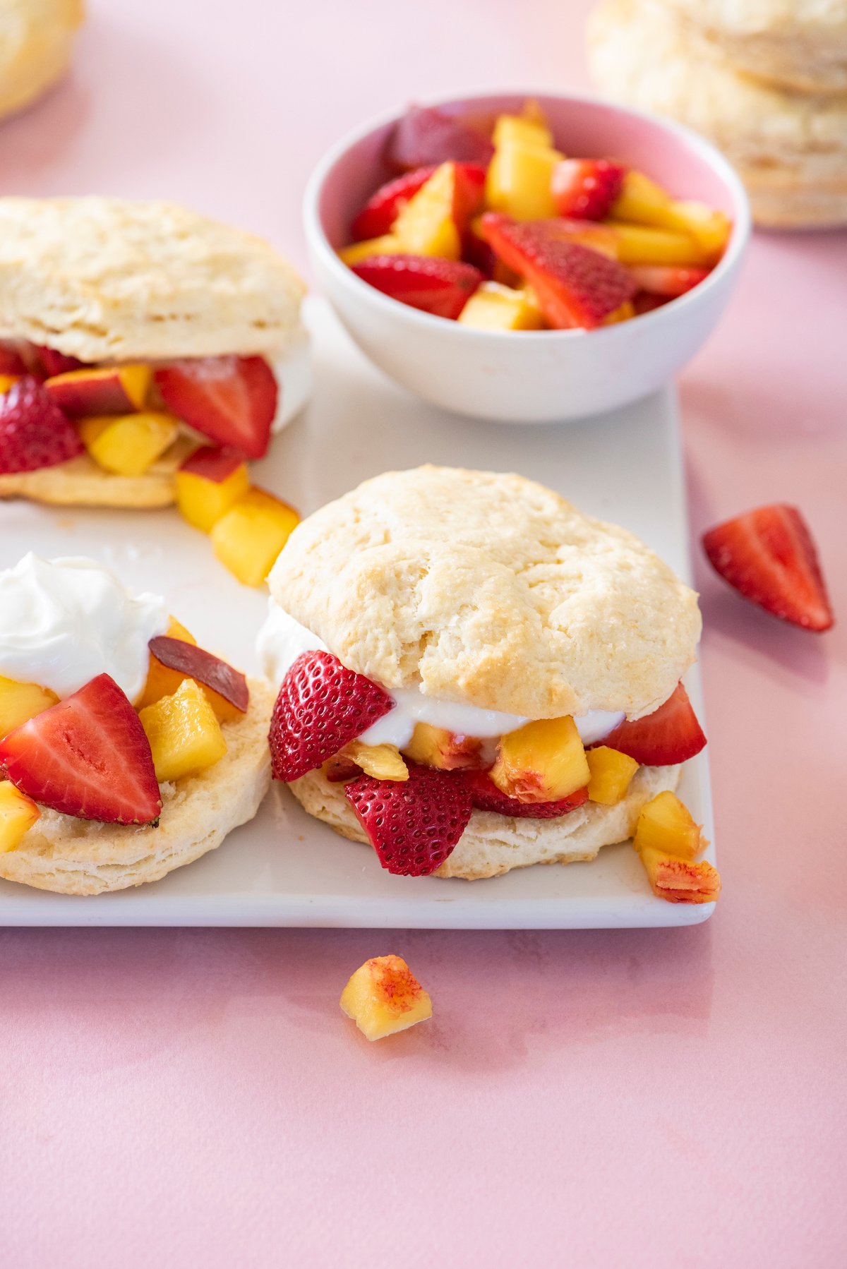 peach and strawberry shortcakes on serving platter
