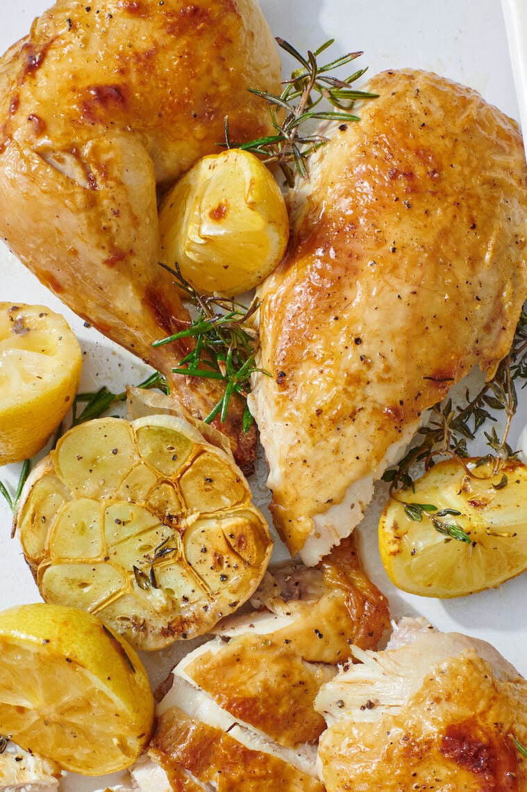 Close up of roast chicken breast and leg.