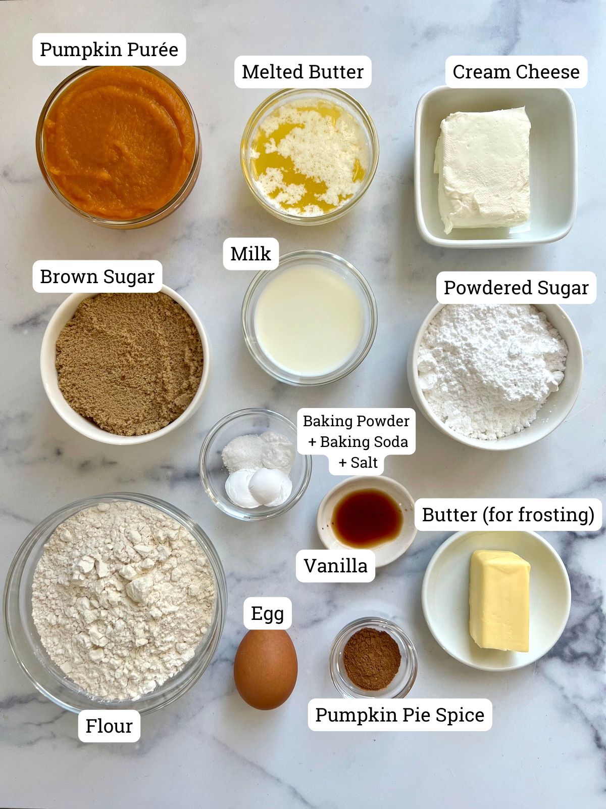 Pumpkin muffins and cream cheese frosting ingredients.