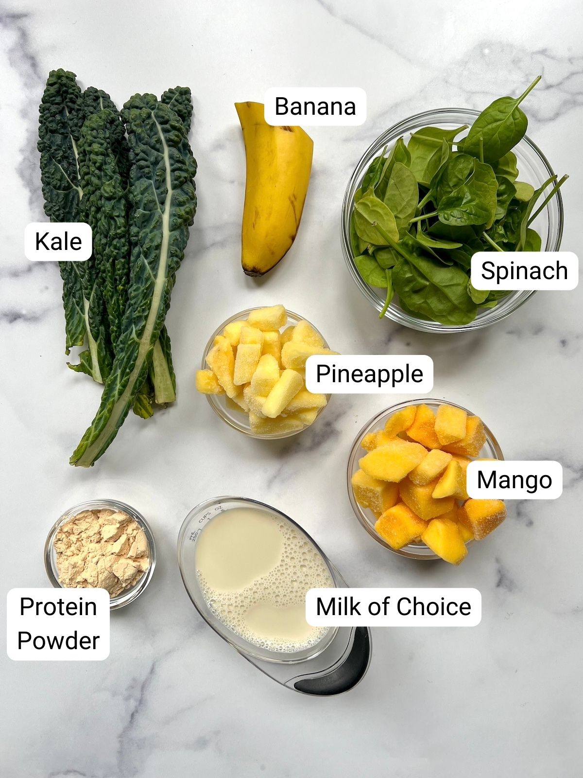 Tropical protein greens smoothie ingredients. 