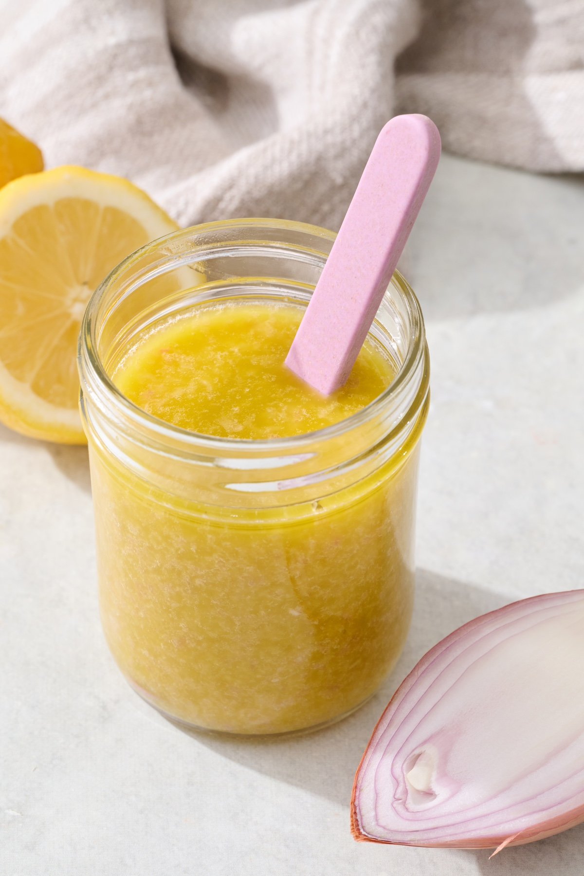 Lemon vinaigrette dressing in mason jar.