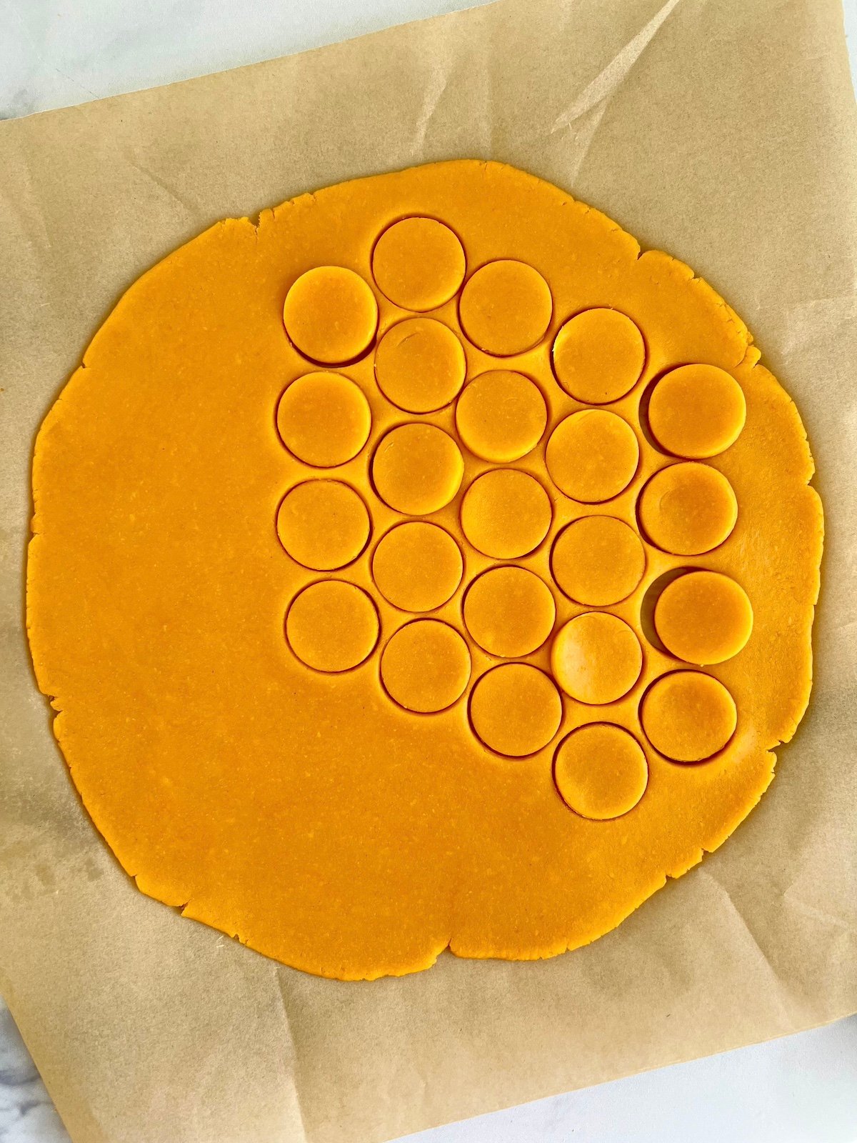 Cutting out cheese wafers.