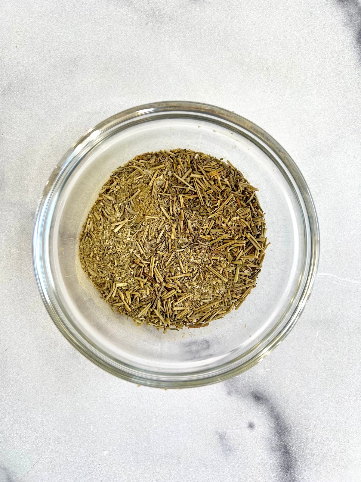 Dried herbs in a small prep bowl.